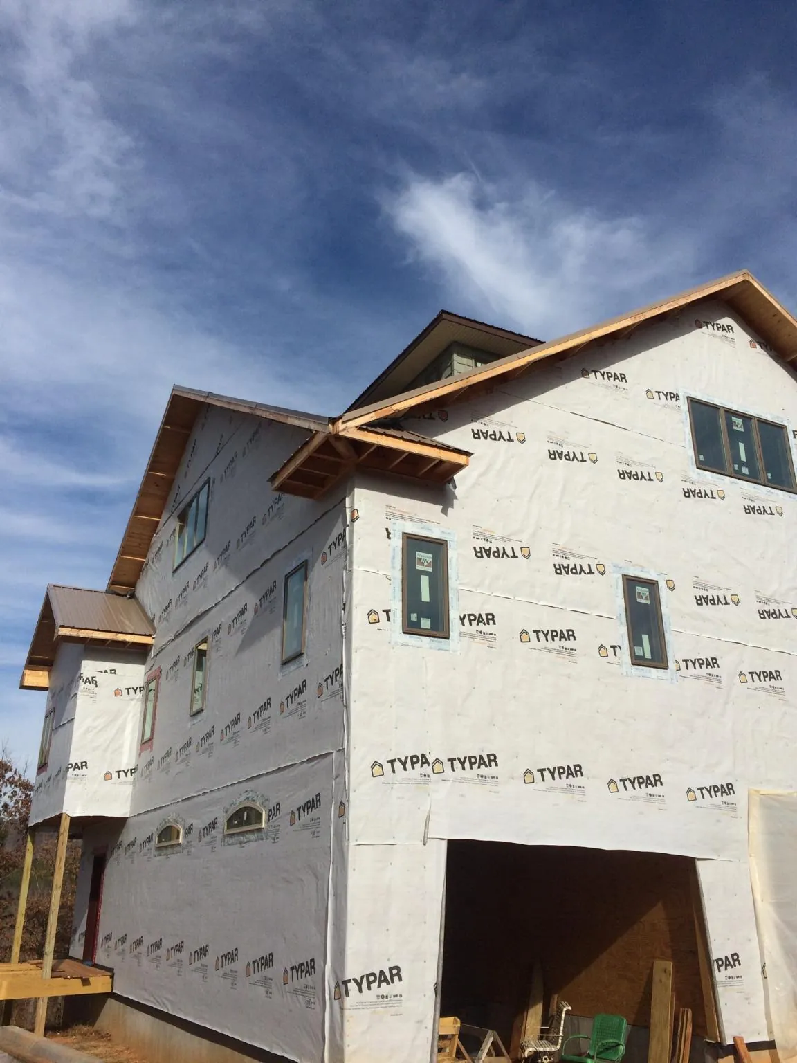 Stick built house wrapped in Typar with new roof framing and dormers in Winchester